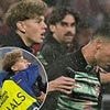 Cristiano Ronaldo grabbed by pitch invader ahead of Portugal's clash with Germany - as stewards are forced to step in after security breach