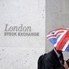 Flying Footsie closes on a record high as sterling hits highest level against the dollar for more than three years