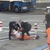 Moment drunk passenger is dragged off Ryanair flight after brawling with others on the jet after he tried to open the emergency doors mid air