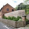 Man who put up 'hideous' 8ft privacy fence around his garden to block out Tesco shoppers finally loses war with council