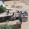 At least seven people die as heavy rains leave waist-high floodwaters in Somalia's capital