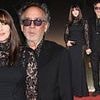 Monica Bellucci, 60, stuns in a dramatic black lace gown as she joins partner Tim Burton, 66, at the Taormina Film Festival
