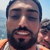 Grinning small boat migrant chronicles his journey across the Channel to the UK - as he films himself celebrating on Blackpool beach after illegally crossing into Britain