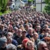 Fans descend on village for rock star's funeral