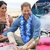 Surf's up, Archie! Prince Harry's son, six, follows in his footsteps as he embraces the California lifestyle and joins a large group of children for a day on the beach and a lesson in wave riding watched by his proud parents