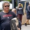 Reclusive 80s lead singer looks unrecognizable with new girlfriend in rare outing... can you guess who?