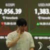 Asian shares decline after mixed Wall Street finish and tensions simmer in the Middle East