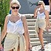 Holly Willoughby flashes her bright blue bikini under a sheer top as she relaxes on summer holiday in Portugal