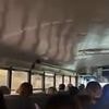 Haunting video of evacuated Camp Mystic kids singing to keep their spirits up - before falling silent as they're confronted with apocalyptic sight