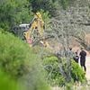Madeleine McCann detectives begin digging with excavator on second day of new search for missing girl in Portugal after investigating run-down building