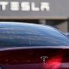Tesla under investigation after parents say faulty door handles trapped their kids in the back