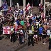 Furious anti-migrant campaigners face off with counter-demonstrators in Portsmouth - as up to 30 asylum seeker hotels brace for more protests and weekend of chaos