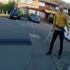 Moment 'killer' attacks police officers with samurai sword as they try to arrest him after schoolboy was slashed to death in street