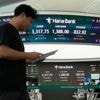 Asian shares are mostly up after US stocks inch to more records as inflation slows