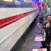 Tourist almost run over while taking photo of train at popular sightseeing spot