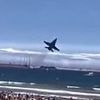 Moment tourists scream as fighter jet performs ultra-low pass over beach during Spanish air show
