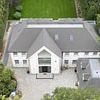 Residents' fury after wealthy neighbour extends his 'horrific' £1million 'American-style McMansion' without planning permission sparking 'war for the ages'