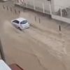 Rain in Spain! Flood and hail warning as holiday hotspot is deluged - while Britain basks in the sun