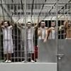 Deported 'Tren de Aragua gangsters' scream in distress in first video from inside El Salvador prison