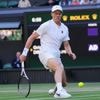 Jannik Sinner starts his Wimbledon quarterfinal against Ben Shelton with a sleeve on his hurt elbow