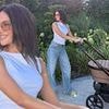 Michelle Keegan cuts a trendy figure in a white crop top and jeans as she poses with daughter Palma in her £1.2K iCandy pram