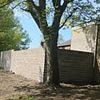Neighbours at war with council after extending gardens by NINE FOOT by building illegal wall to 'protect them from yobs'