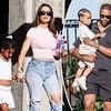 Khloe Kardashian debuts plump pout while playing happy family with ex Tristan Thompson and their two kids