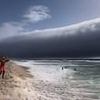 The moment rare 'roll clouds' sweep across Portugal during record heatwave - while in Italy a 'water bomb' kills one person as extreme weather hits the continent