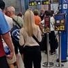 Irish tourist taunts Brits forced to queue for passport control in Spain as he laughs and flashes his EU papers