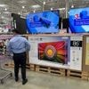 Key inflation gauge rose last month while Americans cut back on spending