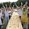Core blimey! Apple strudel chain stretching 3km and made with five tonnes of flour and fruit clinches world record back from rival Croatian town