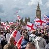 Elgar on a ghetto blaster. A sea of flags and tributes to Charlie Kirk. VERY rude chants about Keir. Then the bottles and fists began to fly... IAN GALLAGHER attends the 110,000-strong 'Unite the Kingdom' march in London