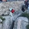 Watch shock moment couple cheat death as they fall off 5,000ft mountain while taking risky shortcut to avoid queue