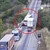 Terrifying moment out-of-control lorry hurtles along bridge and smashes into a car sending it flying over the edge - with occupants somehow surviving