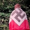 Belgische politicus biedt excuses aan nadat foto met nazivlag opduikt: ‘Dit was een grote fout’