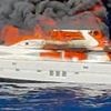 Moment yacht bursts into flames at sea before sinking