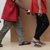 Two men in Indonesia sentenced to public caning over sexual acts: kissing and hugging
